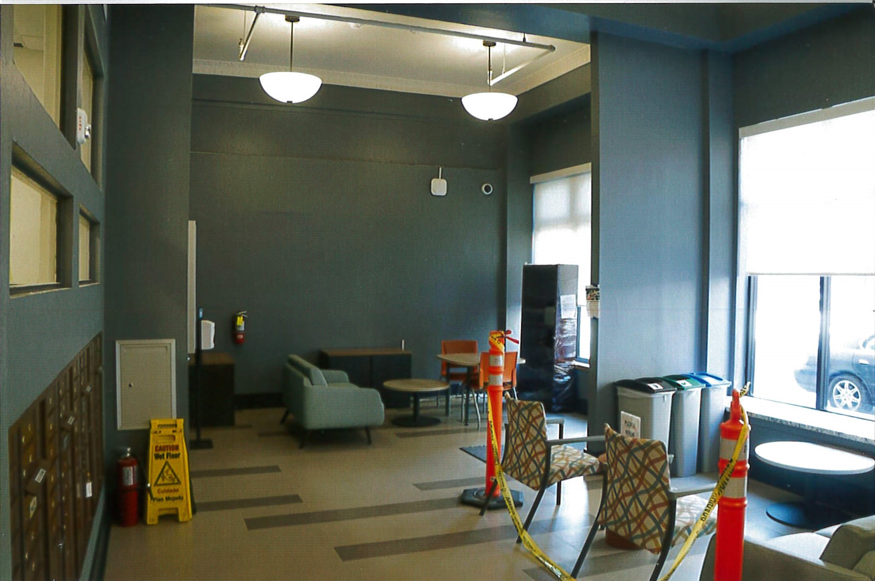 Renovated residential lobby, new flooring, light fixtures